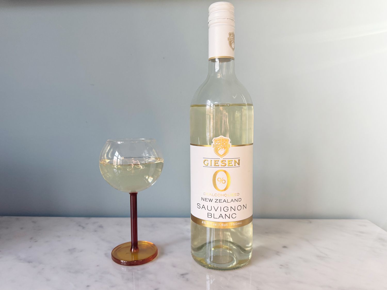 A bottle and glass of Giesen nonalcoholic white wine