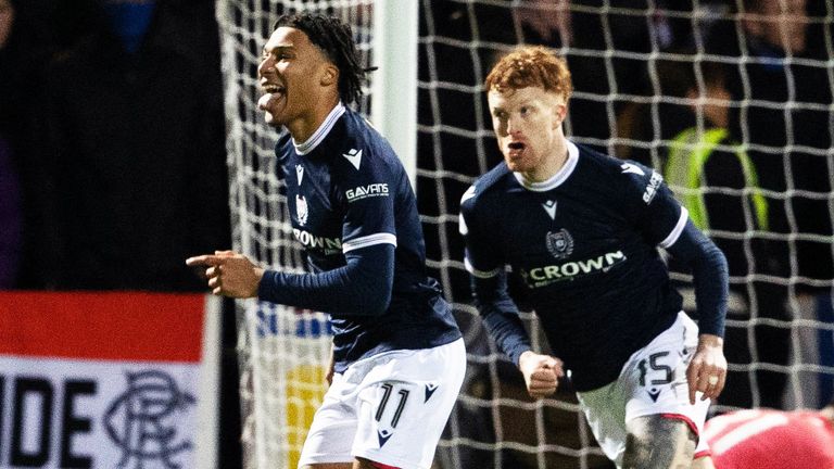 Dundee player Oluwaseun Adewumi celebrates after scoring