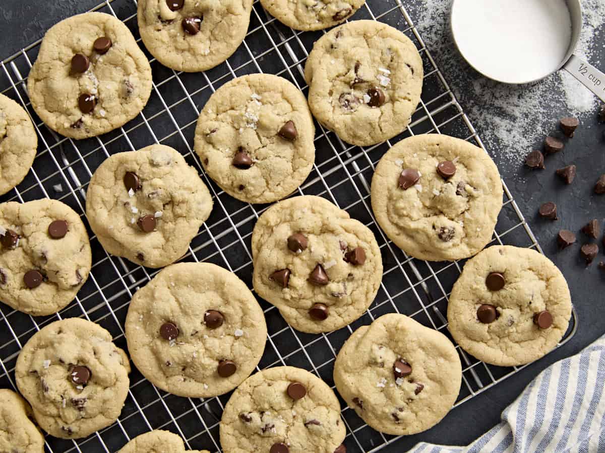 Overhead view of chocolate chip cookies on a cooling rack.