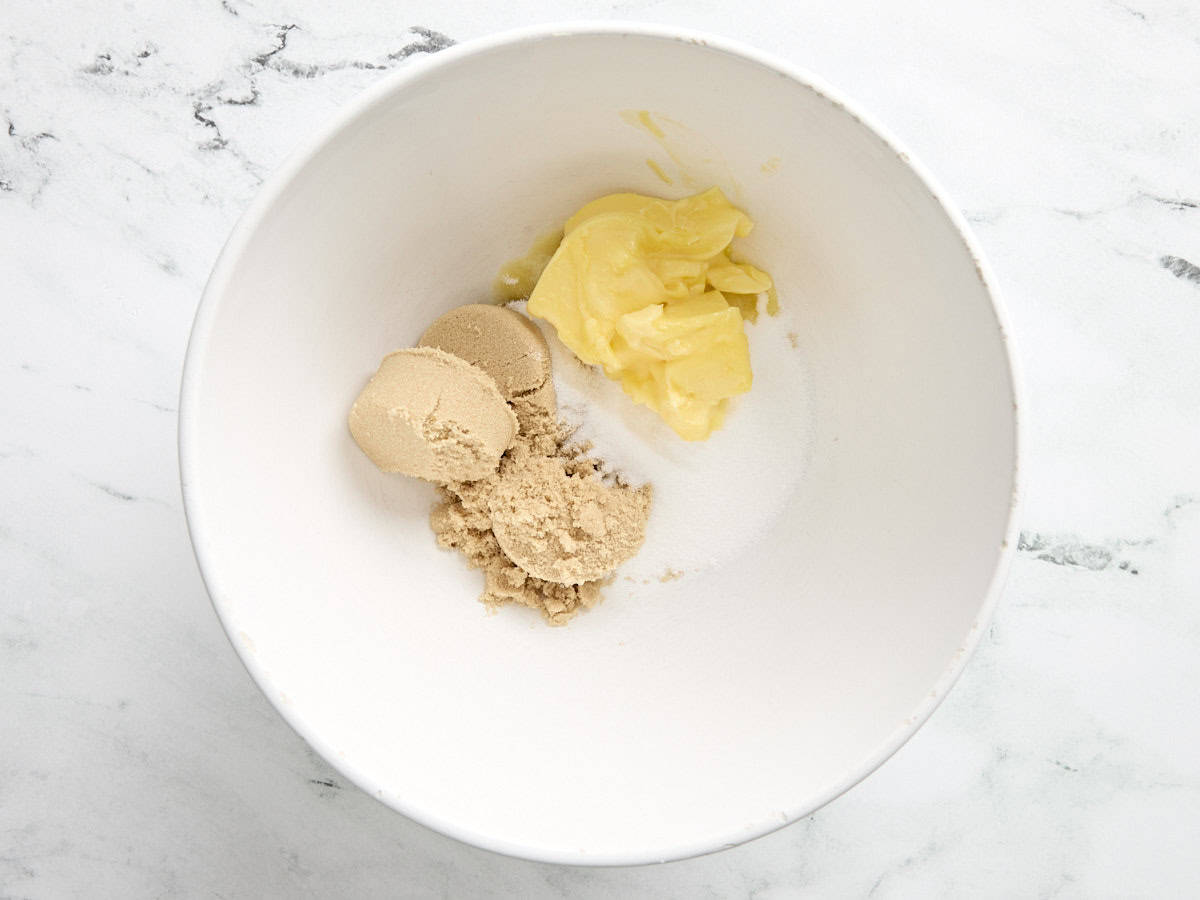 Overhead view of sugar and butter in a bowl.