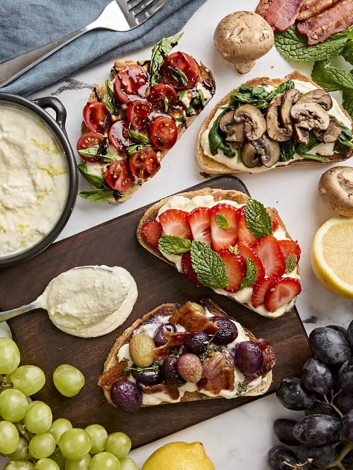 Overhead view of ricotta toast 4 ways.