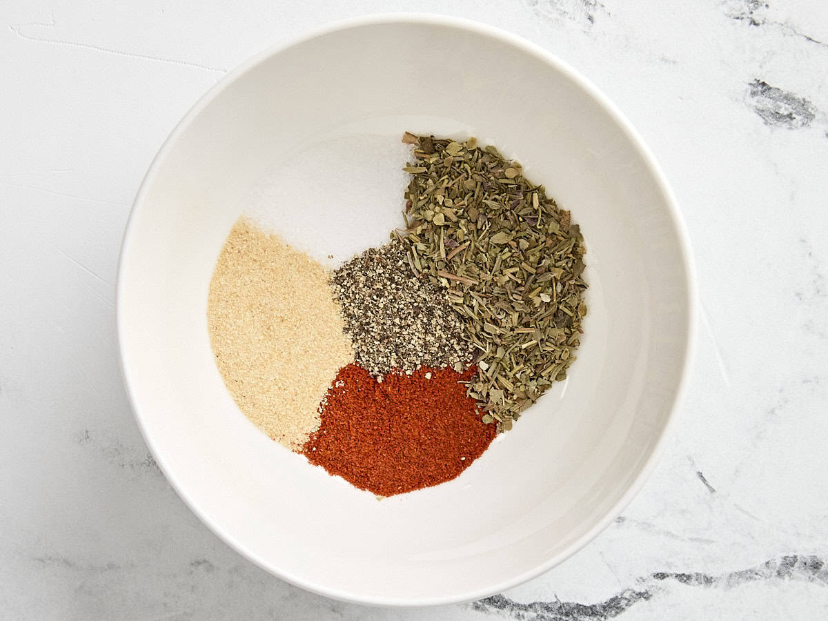 spices in a bowl to make spinach stuffed chicken breast