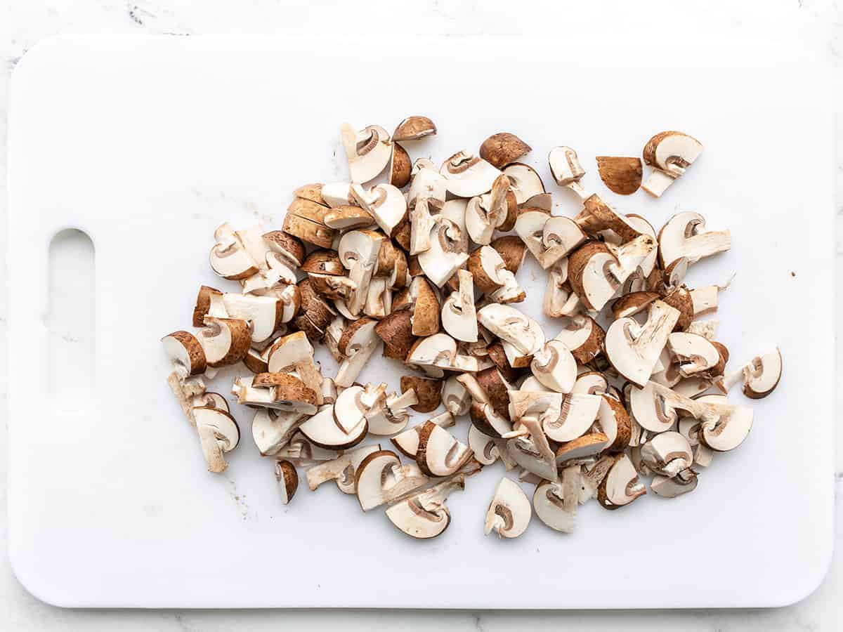 Sliced mushrooms on a cutting board