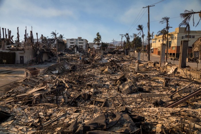 The charred remains of a jewelry store and other shops at the corner of Sunset Boulevard